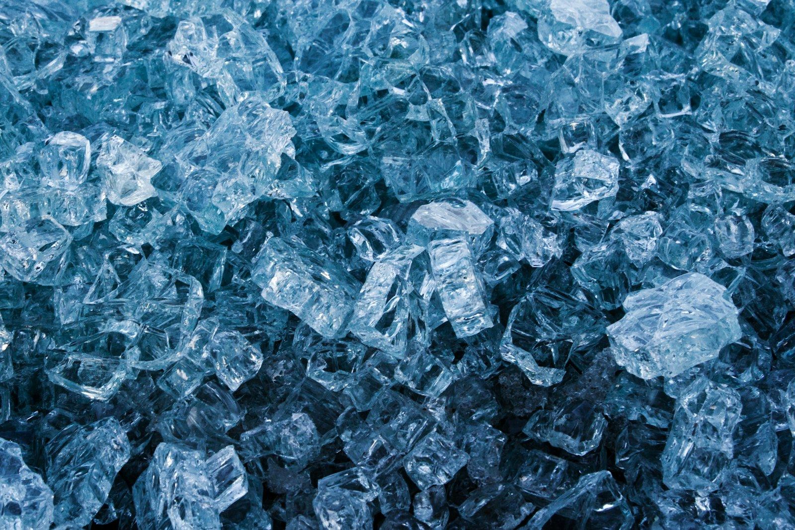 A close field of crushed, blue-lit ice